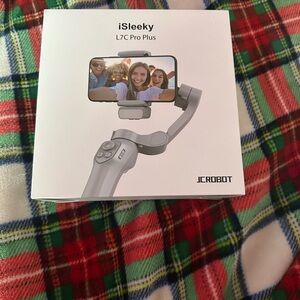 Brand new never used phone tripod with Bluetooth conection.